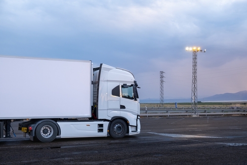 A,Big,White,Truck,Parked,At,A,Service,Station,At
