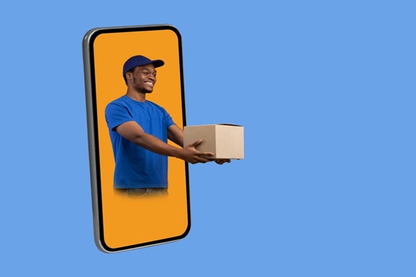 Parcel,Shipping,App.,Black,Deliveryman,In,Phone,Screen,Giving,Cardboard