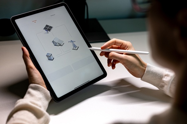 Women,With,Smart,Device,Monitor,Home,Electricity,Production,By,Photovoltaic