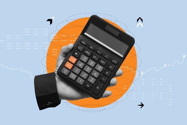 Business,And,Financial,Concept.,Hand,Holding,A,Black,Calculator,Against