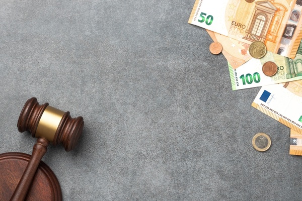 Wooden,Judge,Gavel,On,Euro,Banknotes,And,Coins,On,A