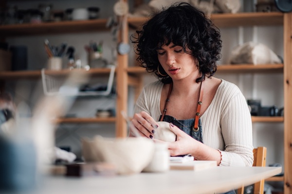 Portrait,Of,Serious,Focused,Pottery,Course,Attendee,Sitting,At,Ceramics