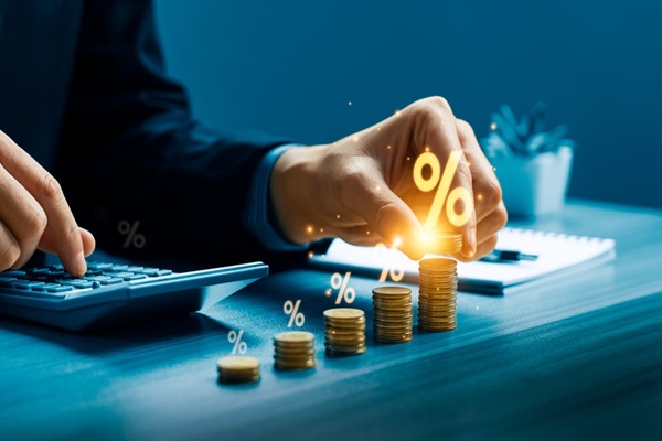 Business,Professional,Calculating,Financial,Interest,Growth,By,Stacking,Gold,Coins
