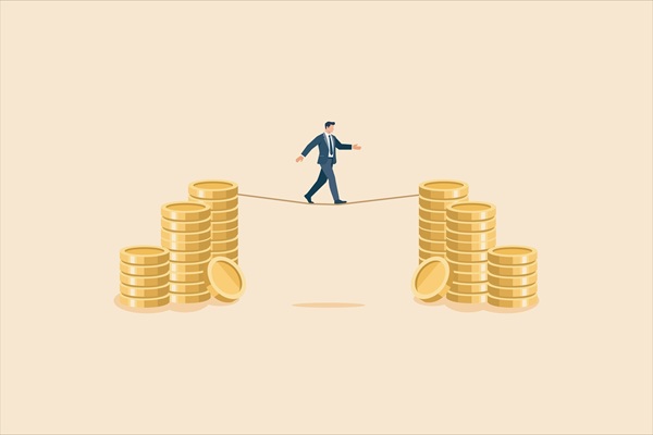 Businessman,Walking,On,A,Tightrope,Between,Piles,Of,Gold,Coins,