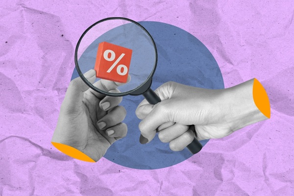 A,Human,Hand,Looking,At,A,Percentage,Symbol,Through,A